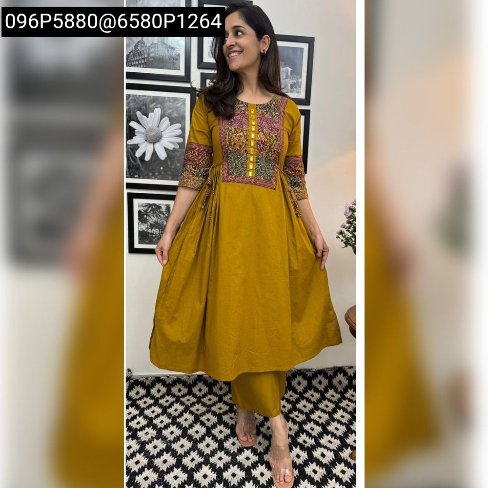 Model smiling and posing in a Mustard Yellow Full Flair Cotton Kurti Palazzo Set
