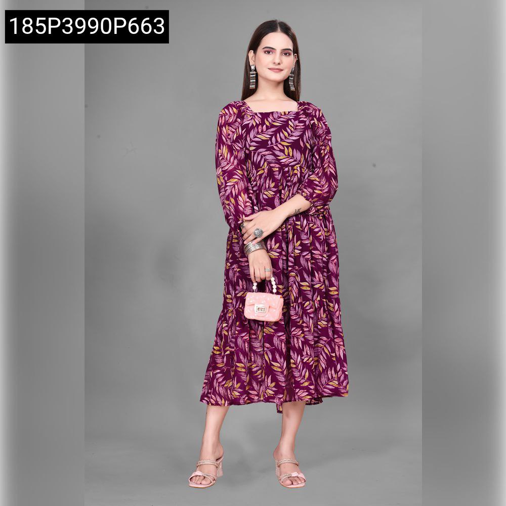 Woman in a flowing purple Georgette party wear dress with leaf print, holding a small pink clutch, smiling.