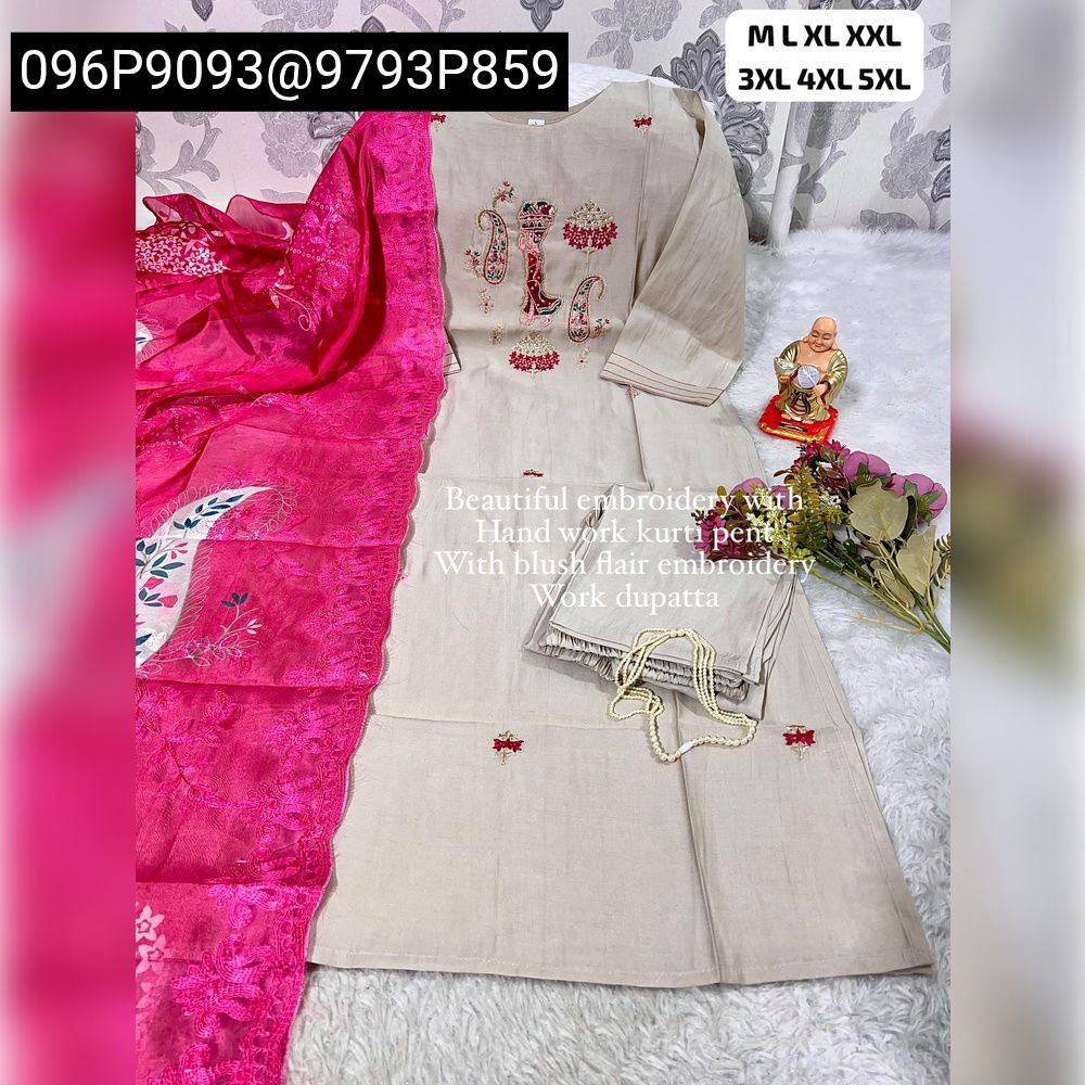 Full view of women's hand work kurti pant set with intricate embroidery and a vibrant pink organza dupatta on a white textured background.