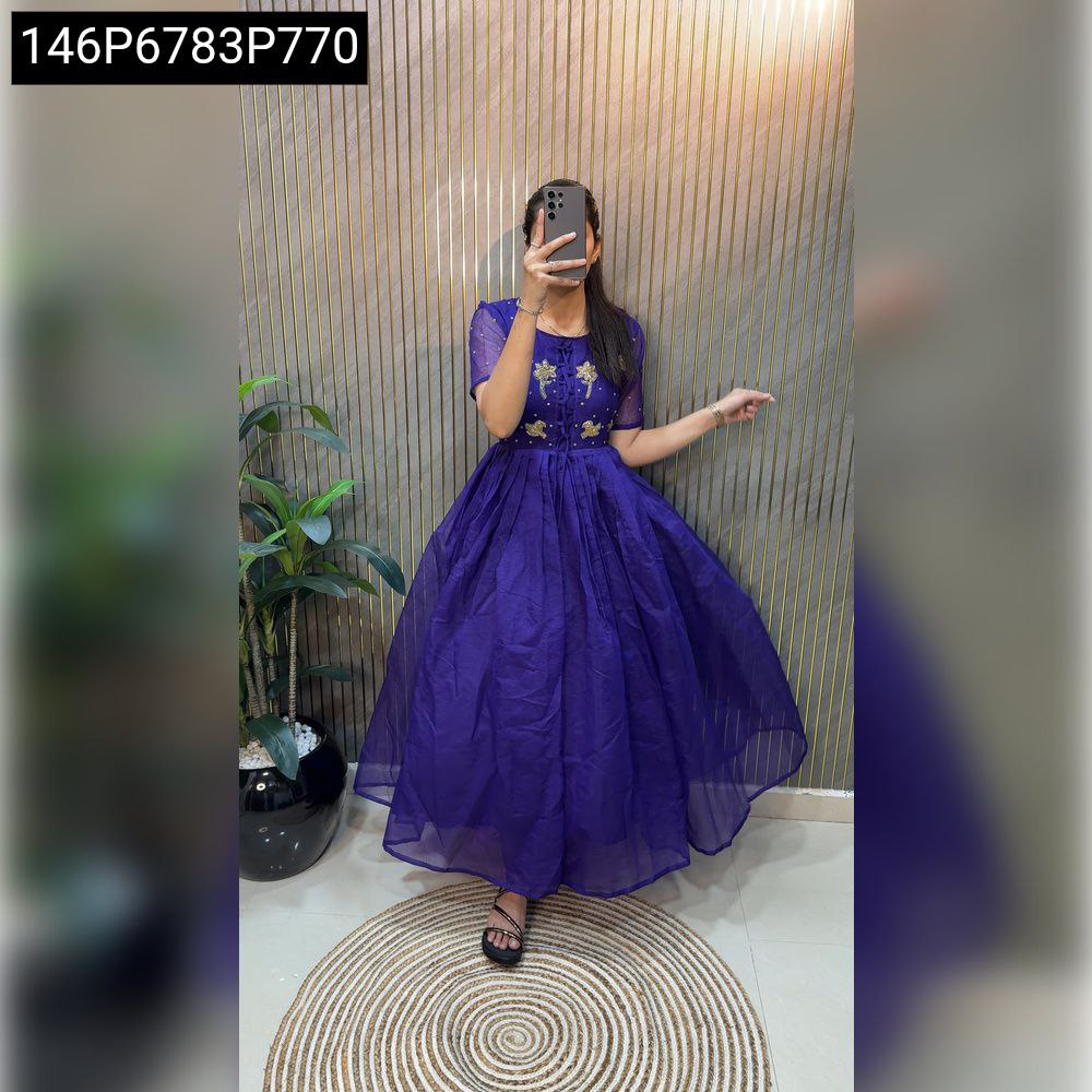 Full body model shot of a woman in a purple hand-work Kota Chex cotton gown, posing elegantly.