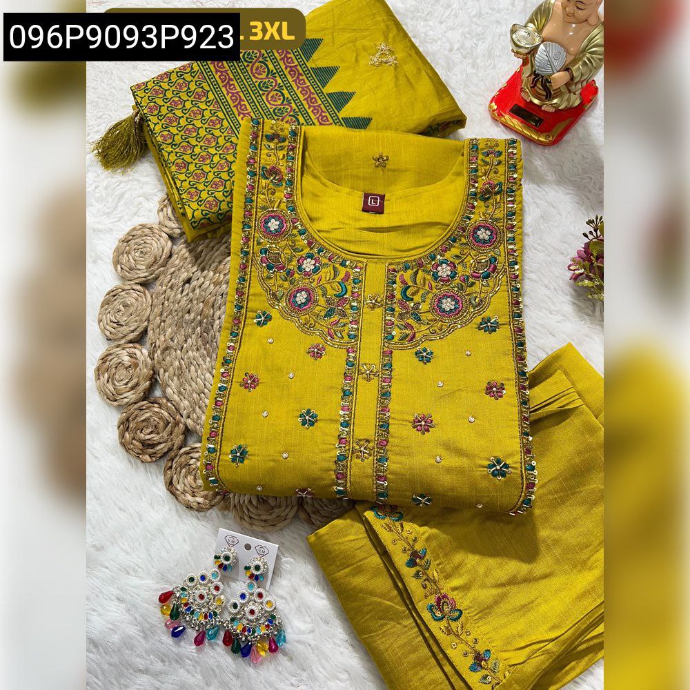 Flat lay of yellow hand work kurti set with dupatta, pant, and colorful earrings.