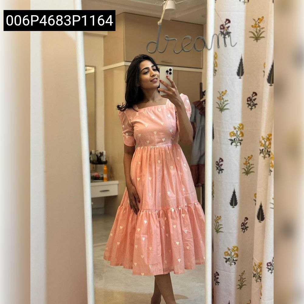 Full body mirror selfie of a woman wearing a peach tiered maxi dress with white heart embroidery, looking chic and comfortable.