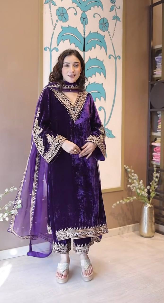 Full body shot of a woman in a lavender velvet embroidered suit set, smiling, perfect for parties.