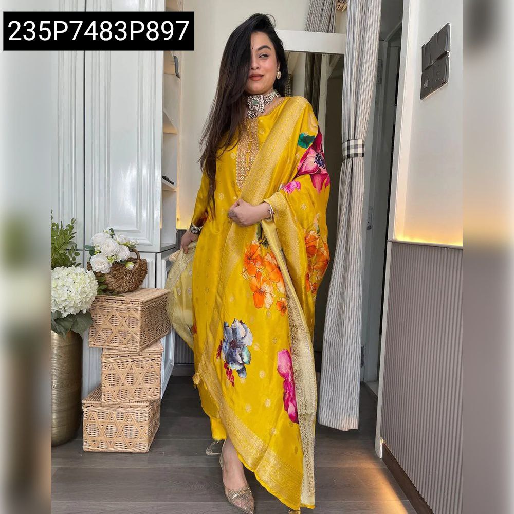 Woman posing in full length yellow Jaquard kurti set with floral printed dupatta, front view.