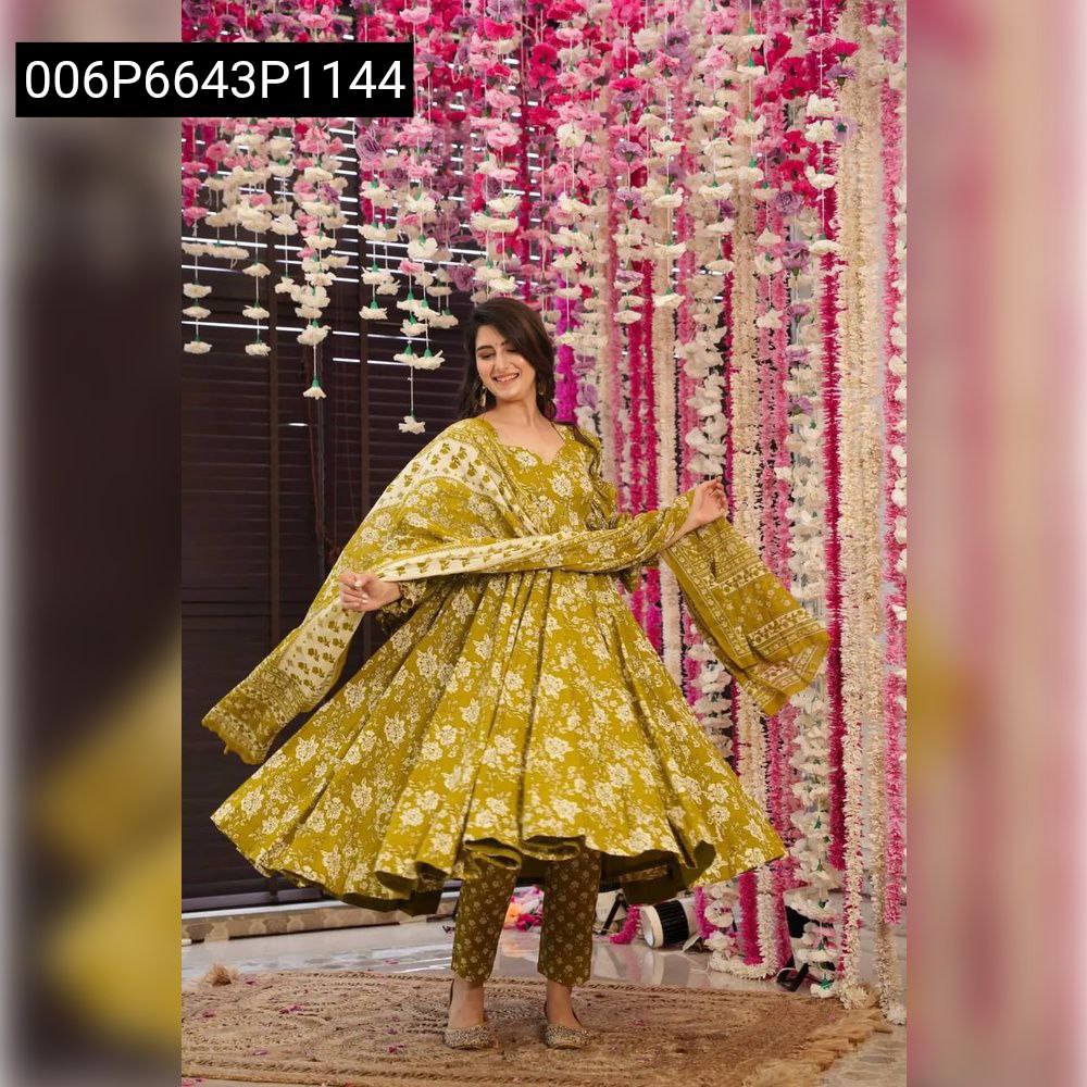 Elegant woman posing in a flowing olive yellow floral Anarkali suit set with dupatta, showcasing the design.