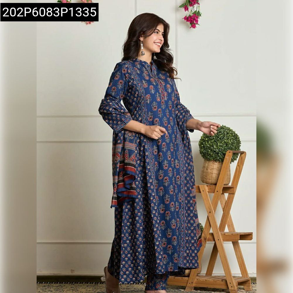 Model wearing Navy Blue printed flared cotton kurta and pant set with dupatta, smiling, side profile.