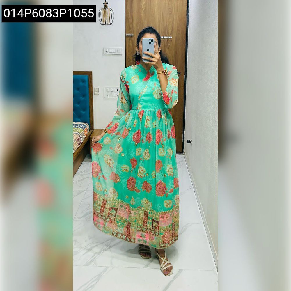Model posing in a full-length teal floral printed georgette kurti with embroidery.