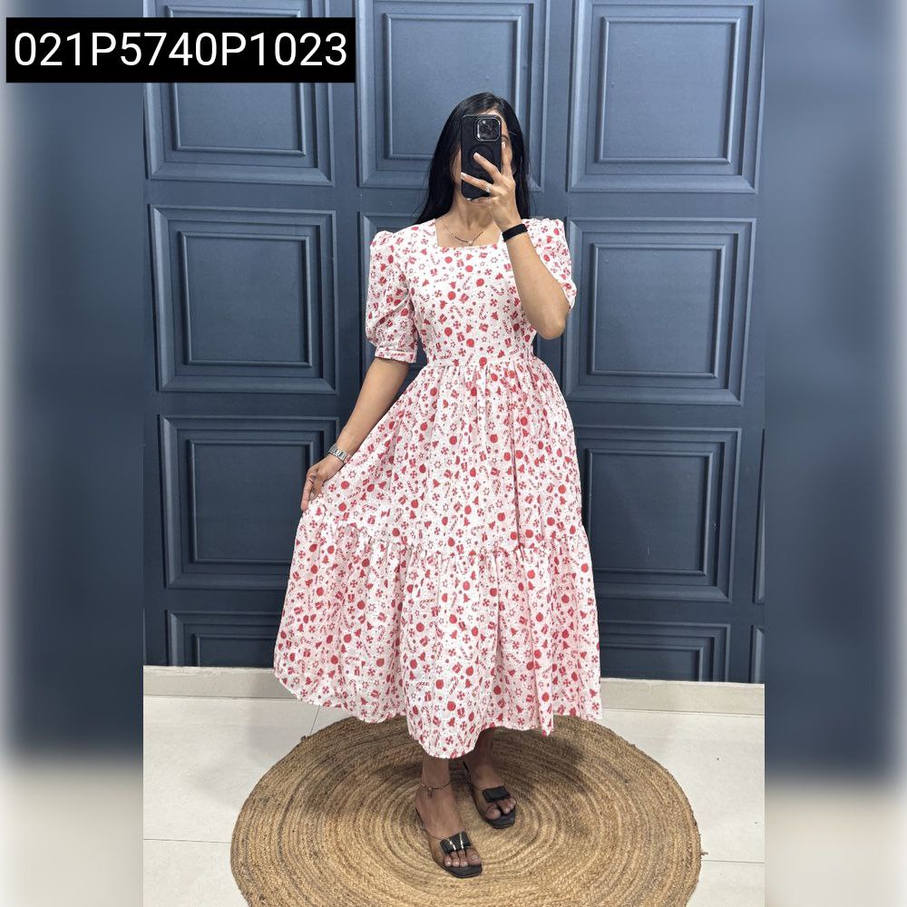 Woman wearing white with red Christmas print Hakoba maxi dress, full body.