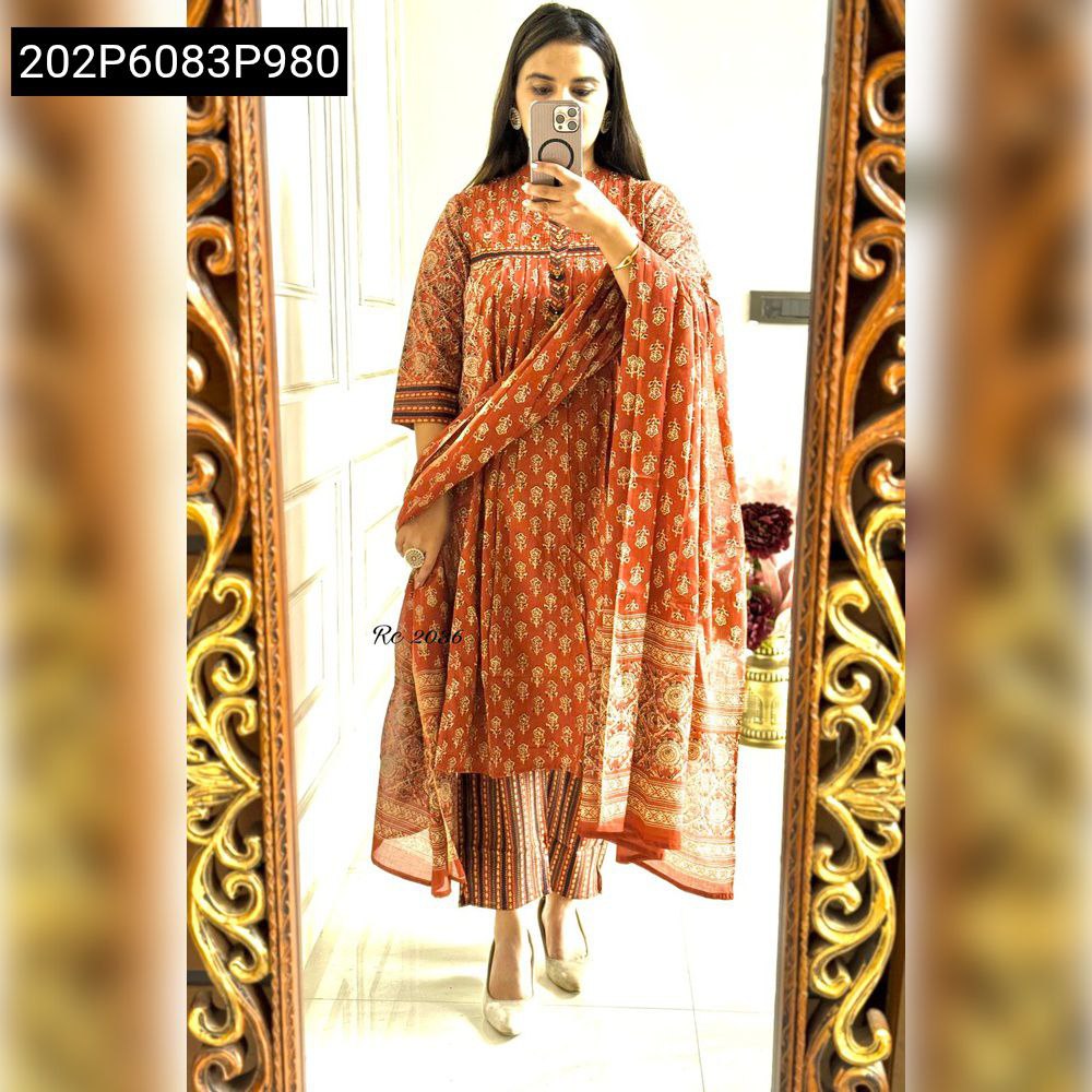 Full body shot of model wearing Rust Orange Pure Cotton Printed Suit Set with matching dupatta.