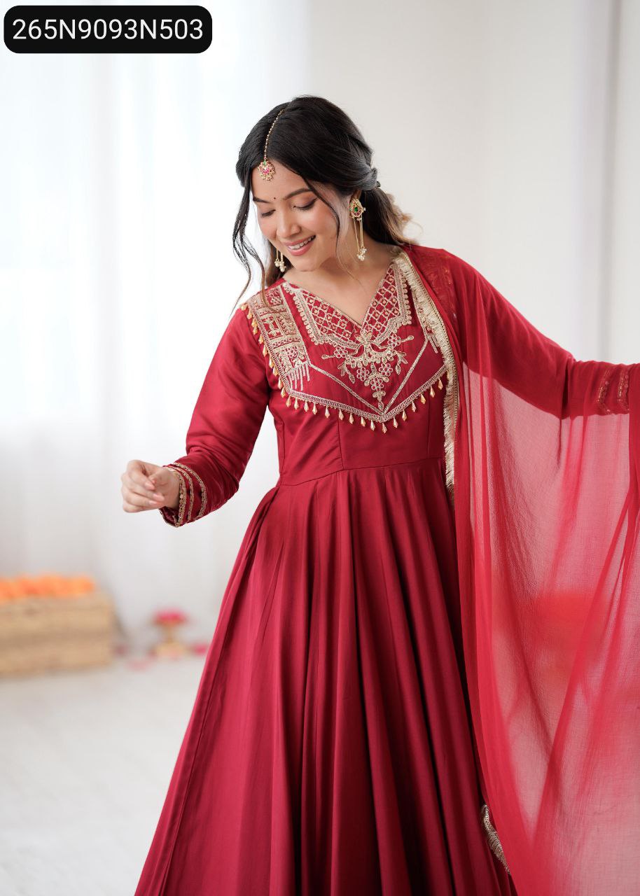 Model in Maroon Roman Silk Anarkali Gown with codding work, front view.