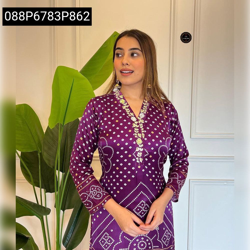 Woman posing elegantly in a regal purple Viscose Silk Kurti, featuring traditional Langadi Patta print and intricate gold embroidery on the neckline.