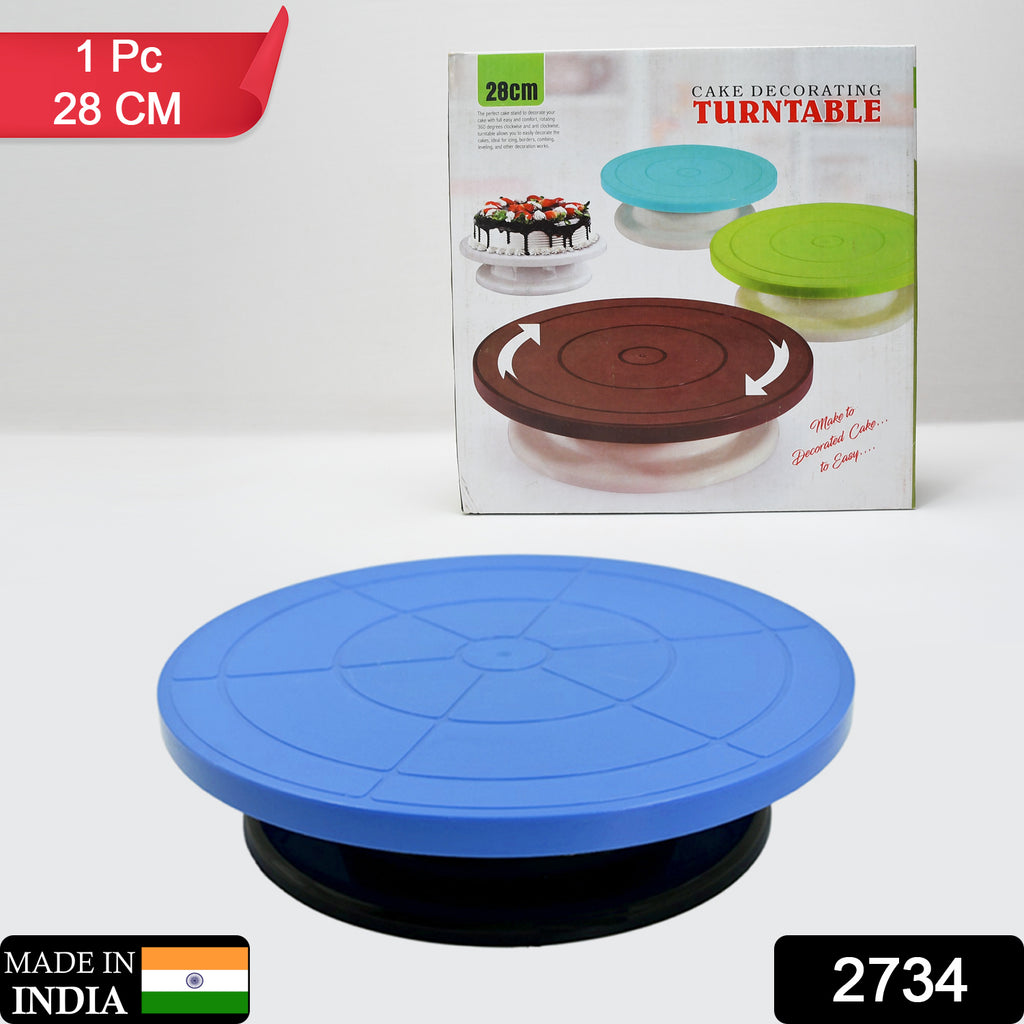 White revolving cake decorating turntable stand with cake for easy home birthday party use