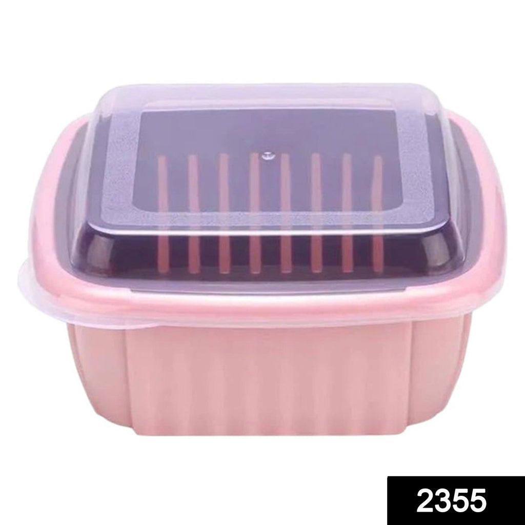 Green double layer food drainer washing basket with collapsible strainers colander, holding fresh fruit.
